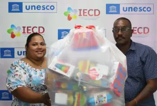 Brigitte receiving donation of educational resources and toys