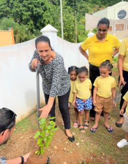 Vice-Chairperson-of-IECD-Mrs-Sonia-Mancienne-planting-the-first-tree-at-Kinderland